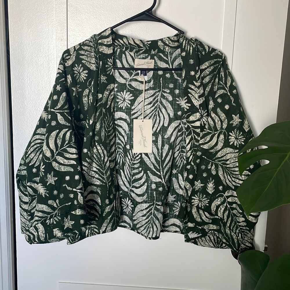 Never been worn, one size fits most cover up.